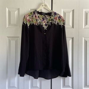 Black silky blouse from the limited collection, floral detailed top.